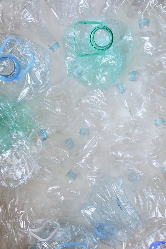 Top view of crumpled plastic bottles, symbolizing recycling and sustainability.